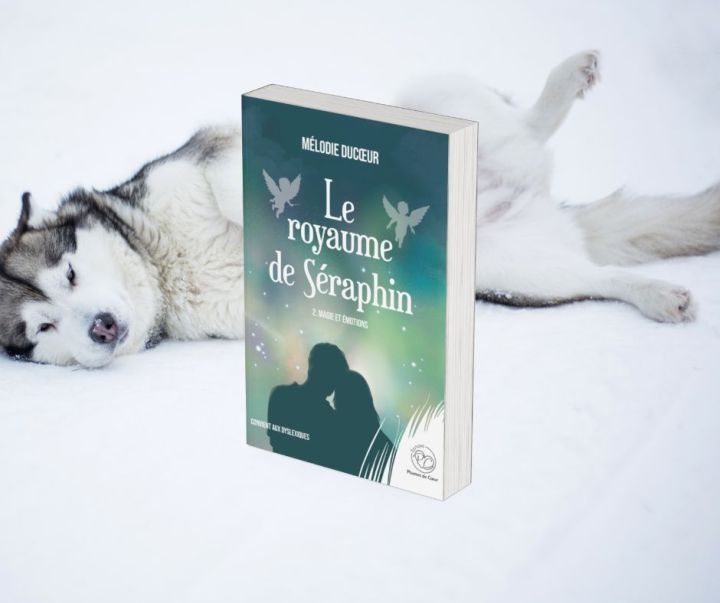 un husky couché dans la neige, devant lui le roman le royaume de Séraphin 2. magie et émotions